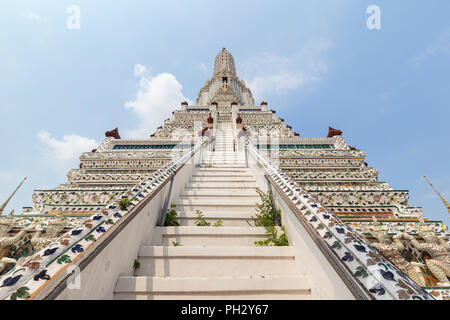 Front and low angle view of decorated Wat Arun temple in Bangkok, Thailand, on a sunny day. Stock Photo