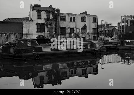 Canal boat moored on Regents canal in Haggerston area of London nearby Bethnal Green Stock Photo