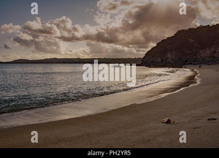 Sunset on Carlyon beech, Carlyon Bay in Cornwell England. An empty shore once the school holidays are over. Stock Photo