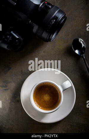 Coffee cup with reflex camera Stock Photo