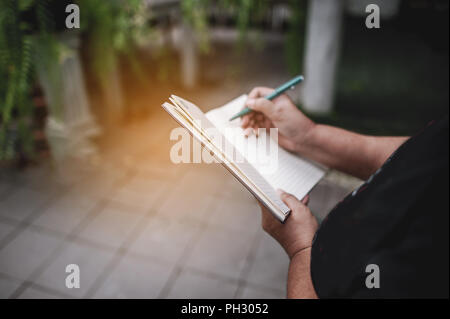 Note taking Notebooks for teaching Remember to forget about things. With our own hands Stock Photo