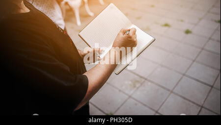Note taking Notebooks for teaching Remember to forget about things. With our own hands Stock Photo