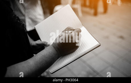 Note taking Notebooks for teaching Remember to forget about things. With our own hands Stock Photo