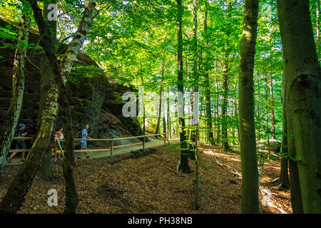 Hikers along the trail to Pravčická brána in Bohemian Switzerland, a picturesque region in the north-western Czech Republic. Stock Photo