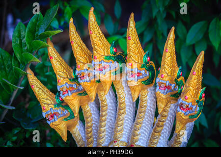 Golden statue of seven head of Naga fountain that decorated in the garden. Stock Photo