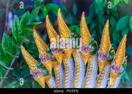 Golden statue of seven head of Naga fountain that decorated in the garden. Stock Photo