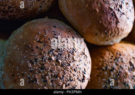 Close-up of a pile of multigrain-coated "brun pav" loaves (hard-crust bread), which are a speciality of Irani cafes and Parsi bakeries in Mumbai. Stock Photo