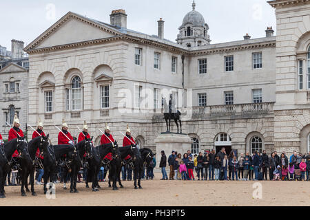 London, United Kingdom - October 29, 2017: Mounted guards and tourists near Horse Guards of Whitehall in London Stock Photo