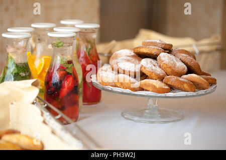 fruit drinks and cookies on the table Stock Photo