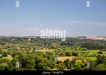 Lush green countryside surrounding the medieval cathedral city of Salisbury in Wiltshire, UK, on a clear summers day. Stock Photo