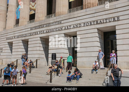 Visitors wait to enter the Donald W. Reynolds Center for American Art and Portraiture, part of the Smithsonian Institution in Washington, DC. The cent Stock Photo