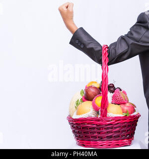 Group fruit in basket on white background, hand business holding basket fruit, Stock Photo