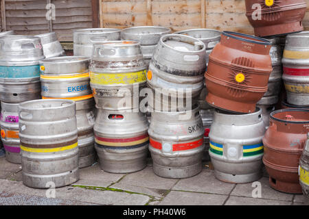 Empty beer kegs ready for collection outside on the pavement UK Stock Photo