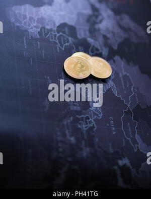 Cryptocurrency coin gold on blurred map world background, Stock Photo