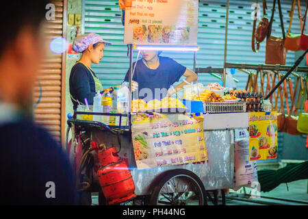 Bangkok, Thailand - March 2, 2017:  Street food vendor cooking and selling Pad Thai fried noodles at Khao San Road night market, Bangkok, Thailand. Stock Photo