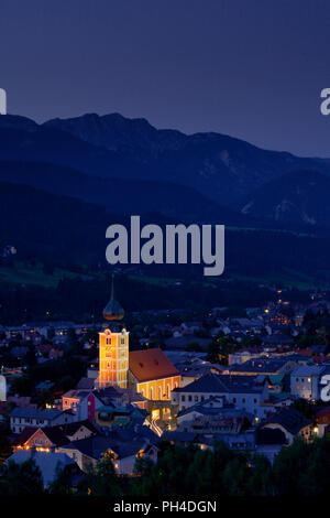 The town of Schladming, Austria, at dusk, set against the Dachstein Mountains Stock Photo
