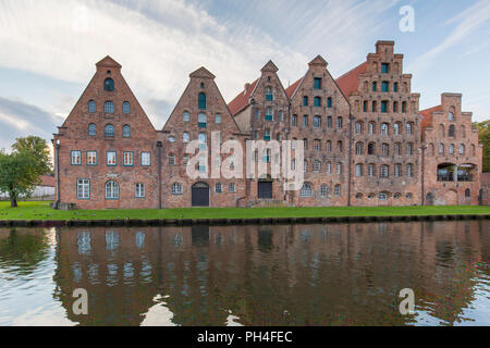 Historic salt storehouses (Salzspeicher) on the river Trave in Luebeck, Schleswig-Holstein, Germany. Stock Photo