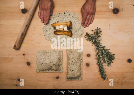 King oyster mushrooms in a pastry shell with butter and rosemary. Stock Photo