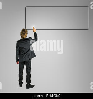 Businessman pushing empty button ready for your text on virtual screen. Stock Photo