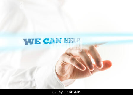 Close Up of Businessman Finger Pointing to Highlighted We Can Help Sign. Stock Photo