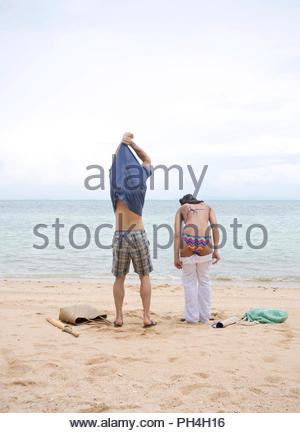 Woman undressing on beach Stock Photo: 138502912 - Alamy