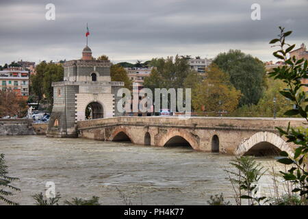 ROME - NOVEMBER 15: Milvio bridge during the flood of the river Tevere on November 15, 2012 in Rome. The river level has reached the maximum in 50 yea Stock Photo