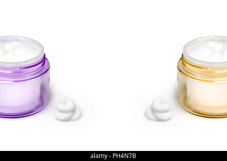 Two containers of moisturizing face cream on white background. Fashion woman still life. Pop female things, medicine and cosmetic theme. Copy space for text Stock Photo