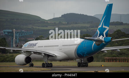 Air Transat flight across the pond departs Glasgow International Airport, Renfrewshire, Scotland - 14th June 2018 Stock Photo