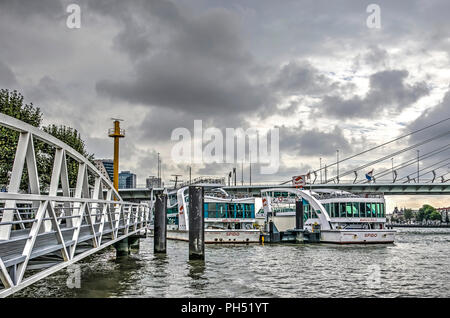 Rotterdam, The Netherlands, August 13, 2018: Spido touring boats at their mooring location next to Erasmusbridge Stock Photo