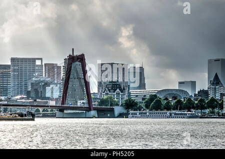 Rotterdam, The Netherlands, August 13, 2018: View from the Nieuwe Maas river towards the city center, with Willemsbridge, the White House and Markthal Stock Photo