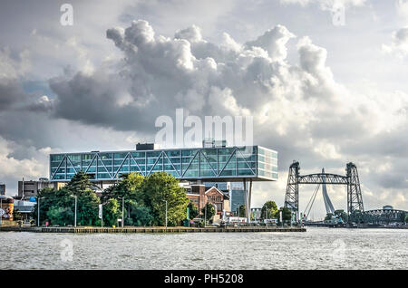 Rotterdam, The Netherlands, August 13, 2018: the striking horizontal beam of the Unilever office and monumental railway bridge De Hef, as seen from th Stock Photo