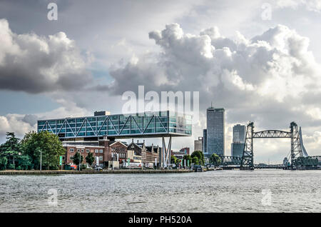 Rotterdam, The Netherlands, August 13, 2018: Dramatic skies over Koningshaven harbour, with monumental steel bridge De Hef and the Unilever office, as Stock Photo