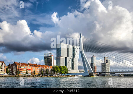 Rotterdam, The Netherlands, August 13, 2018: view from the river towards Erasmus Bridge, Noordereiland neighbourhood and De Rotterdam building Stock Photo