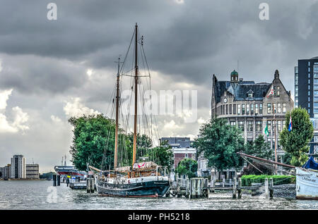 Rotterdam, The Netherlands, August 13, 2018: two mast  sailing yacht moored at the historic Veerhaven harbour in Scheepvaartkwartier neighbourhood Stock Photo