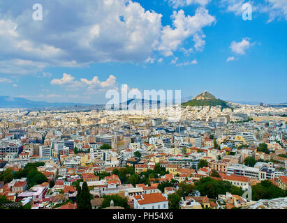 Panoramic view of the city of Athens with the Lykavittos hill in background. View from the viewpoint of Athenian Acropolis. Attica region, Greece. Stock Photo