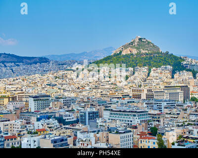 Athens, Greece - July 1, 2018. Panoramic view of the city of Athens with the Lykavittos hill in background. View from the viewpoint of Athenian Acropo Stock Photo