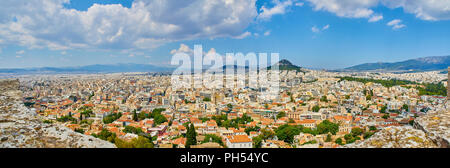 Panoramic view of the city of Athens with the Lykavittos hill in background. View from the viewpoint of Athenian Acropolis. Attica region, Greece. Stock Photo