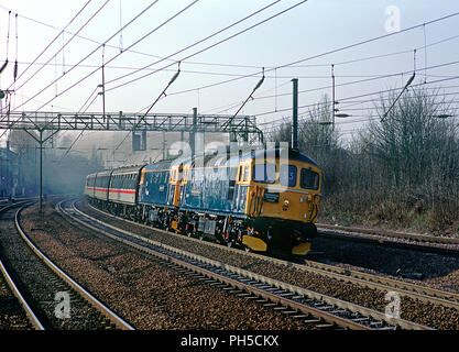 A pair of class 33 diesel locomotives numbers 33116 'Hertfordshire Rail Tours' and 33051 'Shakespeare Cliff' down the ECML with Hertfordshire Rail Tours 'Swineshead Revisited' tour at Harringay on the 22nd March 1997.