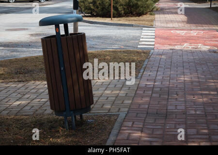 The litter bin in public park and litter around . Stock Photo