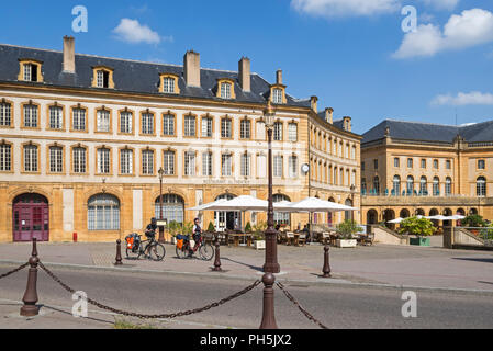 Cyclists in front of Restaurant El Theatris at the Place de la Comédie / Comedy square in the city Metz, Moselle, Lorraine, France Stock Photo