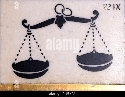 ancient horoscope sign Libra, in black and white marble, on the Milan cathedral floor Stock Photo