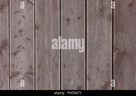 Dingy Grey Barn Wooden Wall Planking Vertical Texture. Old Solid Wood Slats Rustic Shabby Gray Background. Hardwood Dark Weathered Vintage Surface. Stock Photo