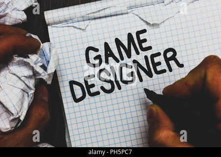 Handwriting text Game Designer. Concept meaning Campaigner Pixel Scripting Programmers Consoles 3D Graphics Man holding marker notebook crumpled paper Stock Photo