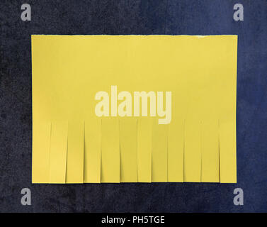 Blank yellow paper with tear off tabs Stock Photo