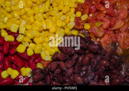 Beans corn and tomatoes. Fresh healthy vegetables for hearty soup, stew or chili. Delicious and nutritious vegetables. Stock Photo