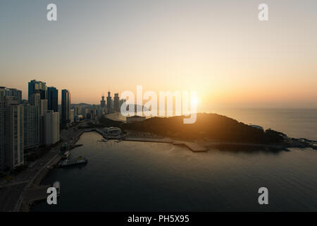 Sunrise at Haeundae beach in Busan. Haeundae beach is Busan's most popular beach in South Korea. Stock Photo