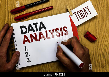 Handwriting text writing Data Analysis. Concept meaning Translate numbers to Analytical Conclusion Forecasting Man holding marker notebook clothespin  Stock Photo