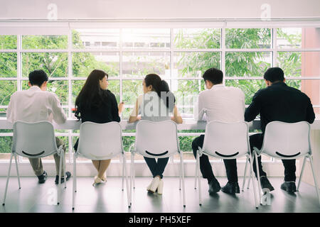 Asian business people group on meeting, Business working discussion in modern bright office indoor with tablet computer. Vintage tone. Stock Photo