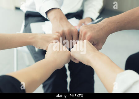 Hand partnership business team giving Fist Bump after complete deal business project Stock Photo