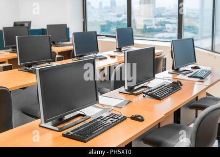 Empty computer room neatly placed for student in a computer lab. Stock Photo